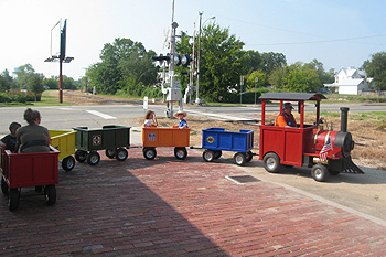 Children riding the Choo Choo Express trackless train at a birthday party