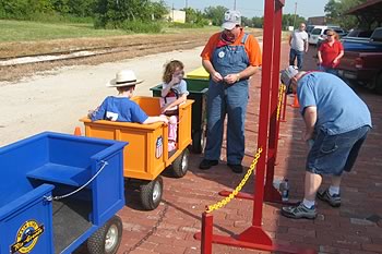 The Choo Choo Express trackless train rolling through a community festival