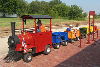 Students aboard the Choo Choo Express trackless train at a school carnival